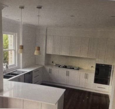 White residential kitchen with island bench